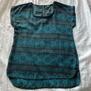 teal and black patterned blouse